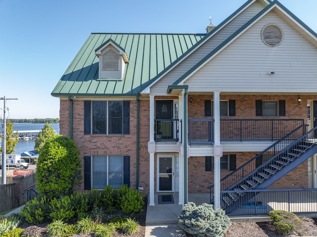 view of front of house featuring a water view