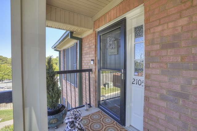 entrance to property featuring covered porch