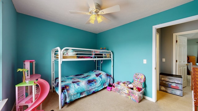 carpeted bedroom featuring ceiling fan