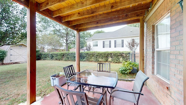 view of patio / terrace featuring a storage unit