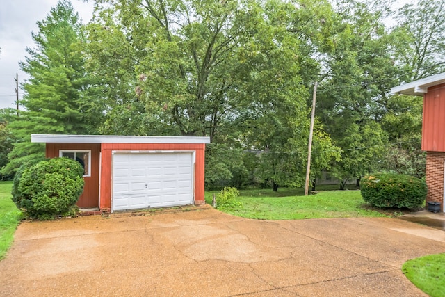 garage featuring a yard