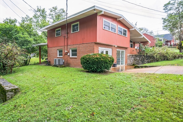 view of property exterior featuring a lawn and central AC unit