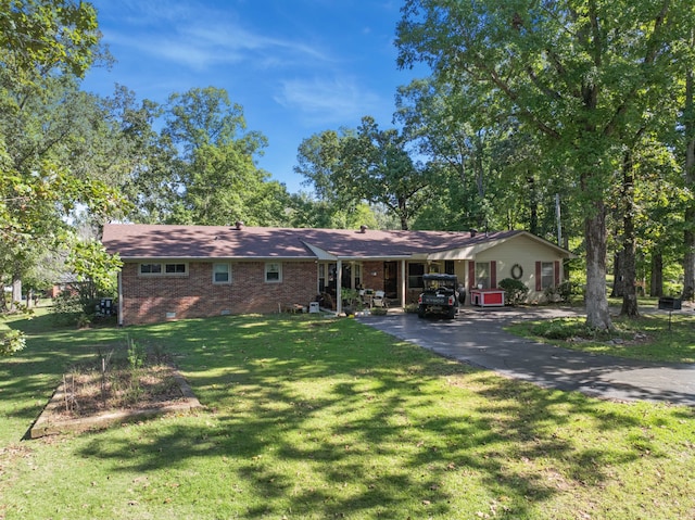 single story home with a carport and a front yard