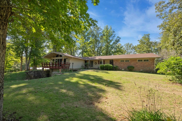 back of house with a lawn