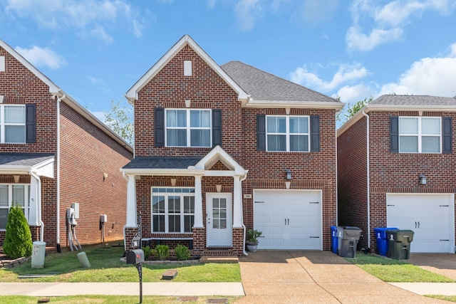 view of front facade featuring a front yard and a garage