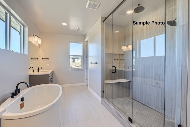 0 Keystone Dr, Pleasant View, TN 37146 - bathroom featuring healthy amount of natural light, vanity, a stall shower, and a freestanding tub