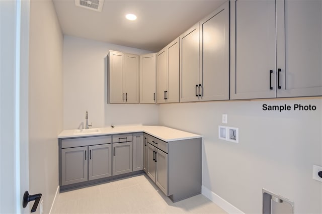 0 Keystone Dr, Pleasant View, TN 37146 - laundry room with hookup for a washing machine, light tile patterned flooring, electric dryer hookup, cabinets, and sink