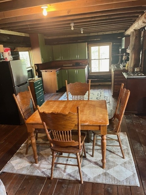 dining space featuring dark hardwood / wood-style flooring