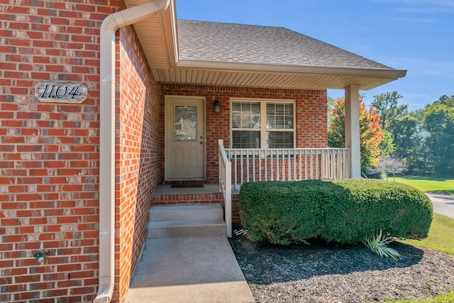 property entrance featuring a porch