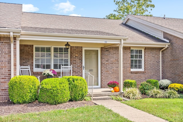 doorway to property with a porch