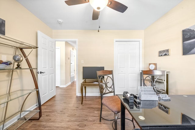 home office with ceiling fan and hardwood / wood-style floors