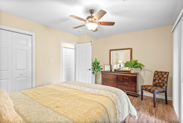 bedroom with ceiling fan and hardwood / wood-style floors