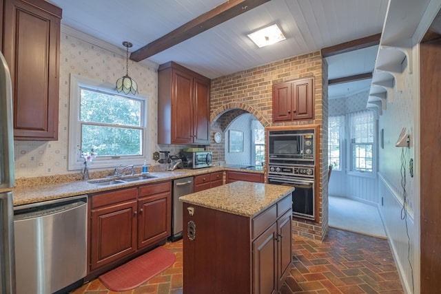 kitchen with wallpapered walls, brick floor, a sink, and black appliances