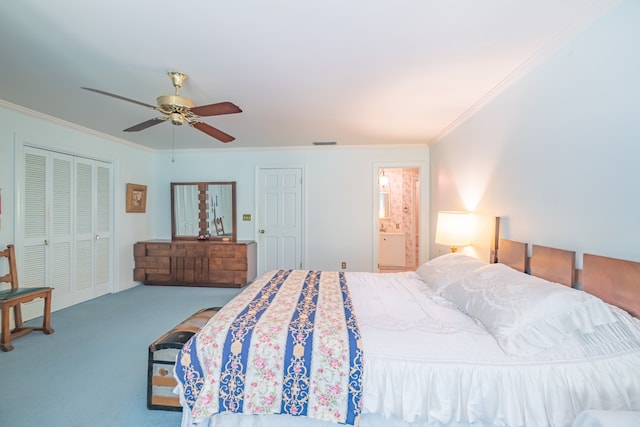 bedroom featuring ceiling fan, carpet flooring, a closet, crown molding, and ensuite bathroom