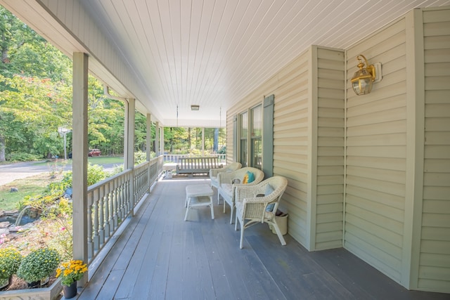 wooden terrace featuring a porch