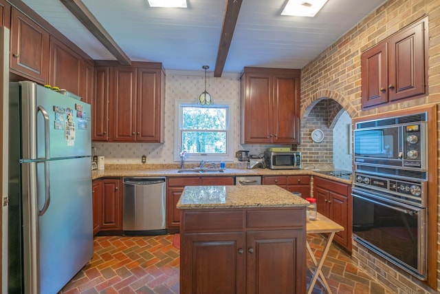 kitchen with brick floor, a sink, black appliances, and beam ceiling