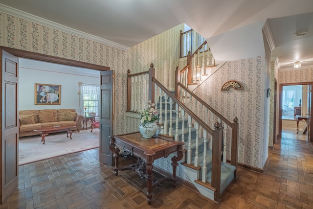 staircase featuring parquet flooring and crown molding