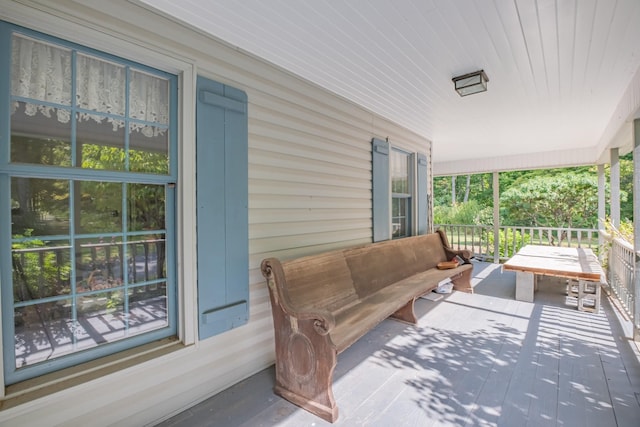 wooden deck featuring covered porch