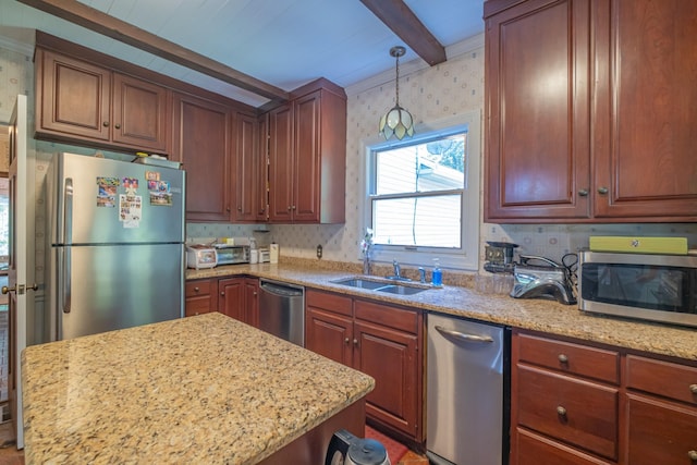 kitchen with light stone countertops, appliances with stainless steel finishes, a sink, hanging light fixtures, and beam ceiling