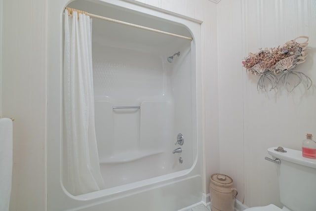 bathroom with toilet and shower / tub combo