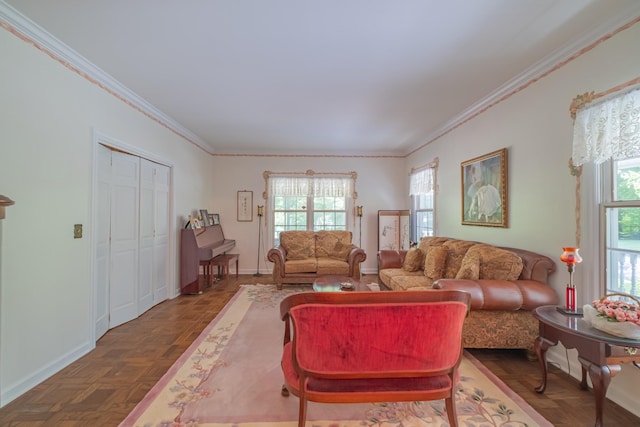 living area featuring baseboards and crown molding