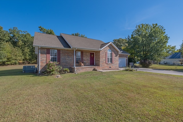 view of front of house with a garage and a front lawn