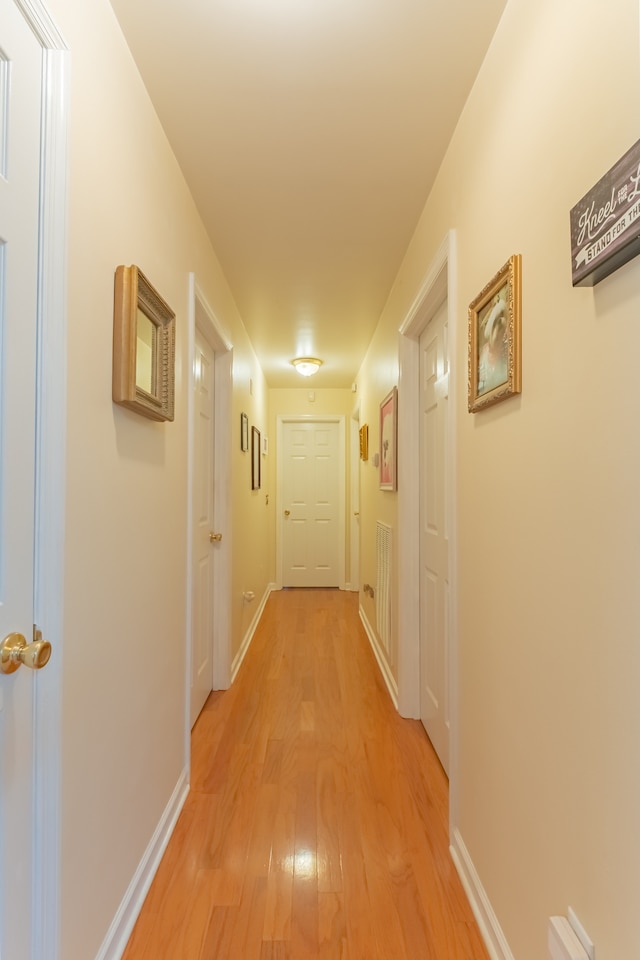 hall with light hardwood / wood-style flooring