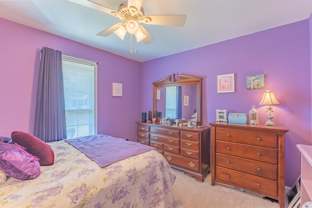 bedroom with ceiling fan and light colored carpet