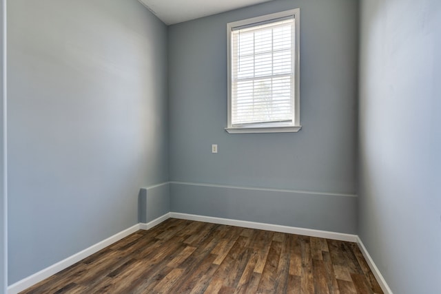 empty room with dark hardwood / wood-style floors