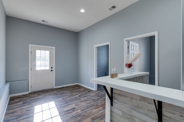 foyer entrance with dark hardwood / wood-style floors