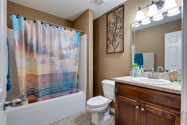 full bathroom featuring vanity, a textured ceiling, tile patterned flooring, shower / tub combo with curtain, and toilet