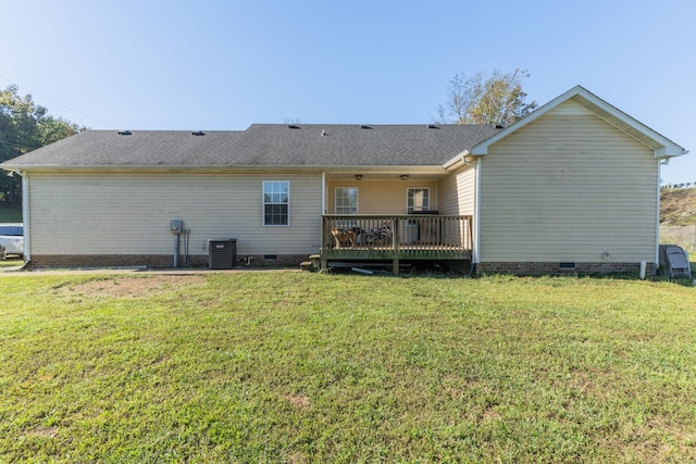 back of house with a wooden deck, central AC, and a lawn