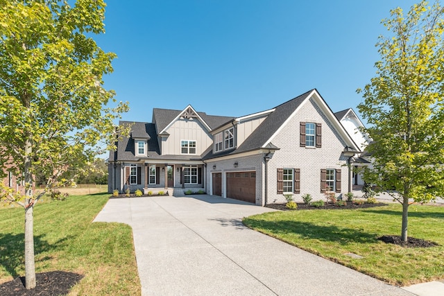 view of front of property featuring a garage and a front lawn