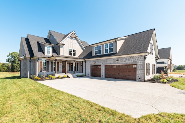 view of front of property featuring a front lawn and a garage