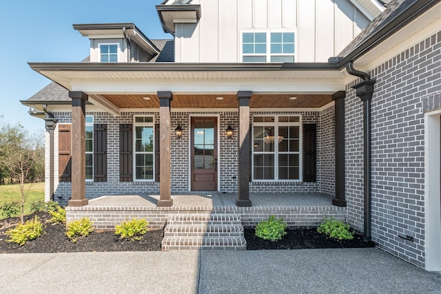 view of exterior entry with a porch