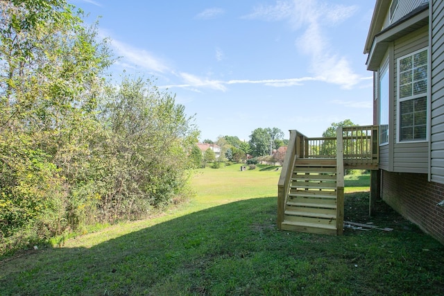 view of yard with a wooden deck