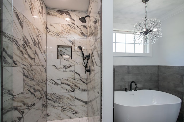 bathroom with an inviting chandelier, shower with separate bathtub, tile walls, and ornamental molding