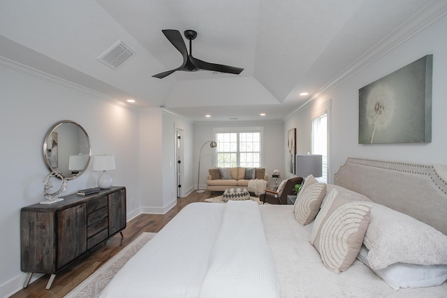 bedroom with ornamental molding, ceiling fan, and dark hardwood / wood-style floors