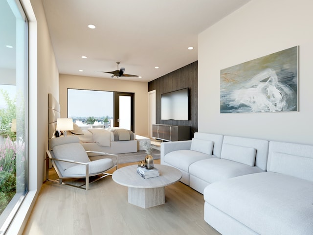 living room with recessed lighting, light wood-type flooring, and a ceiling fan