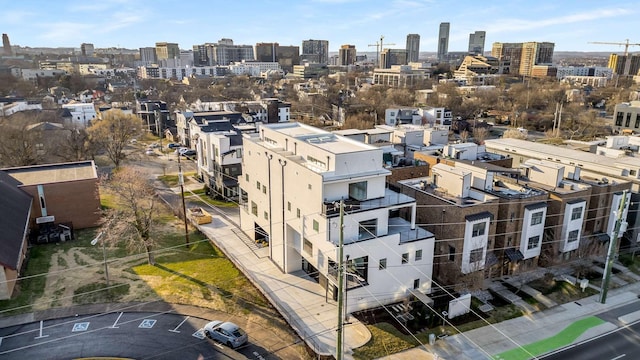 birds eye view of property with a view of city