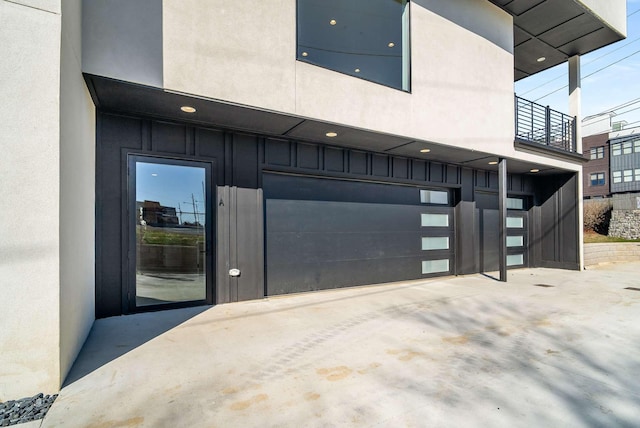 garage with concrete driveway