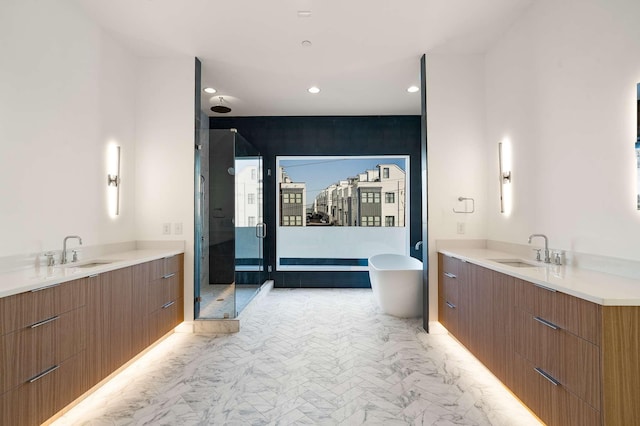 full bathroom with a stall shower, two vanities, and a sink