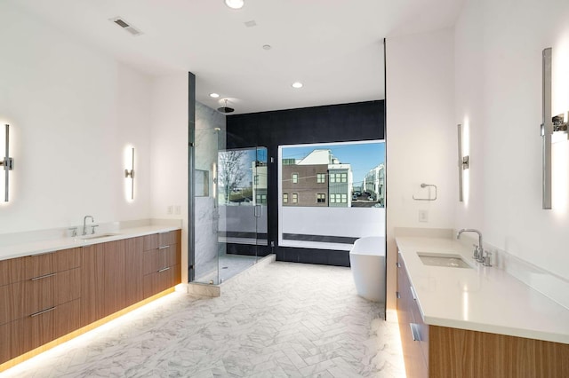 bathroom with a sink, visible vents, two vanities, and a shower stall