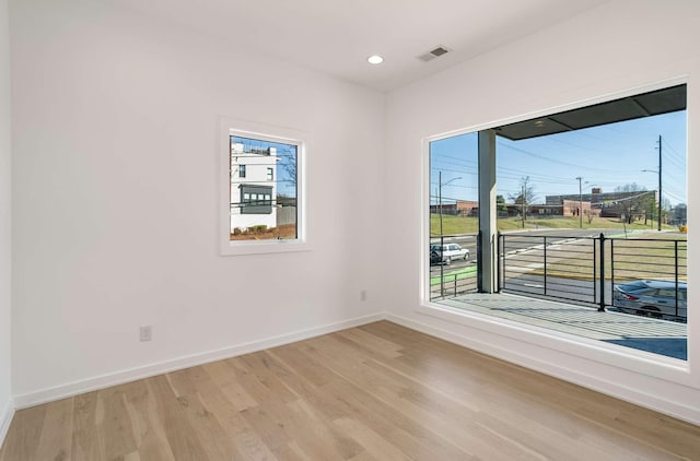 unfurnished room with recessed lighting, visible vents, baseboards, and light wood-style flooring