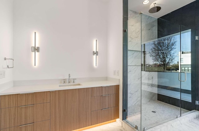 full bathroom with recessed lighting, vanity, marble finish floor, and a shower stall