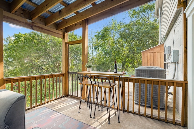 wooden deck featuring cooling unit