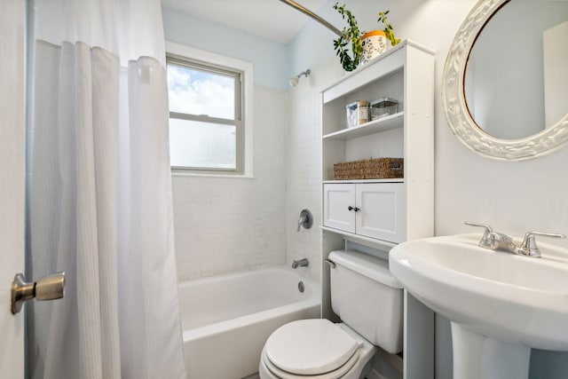 full bathroom featuring shower / tub combo, toilet, and sink