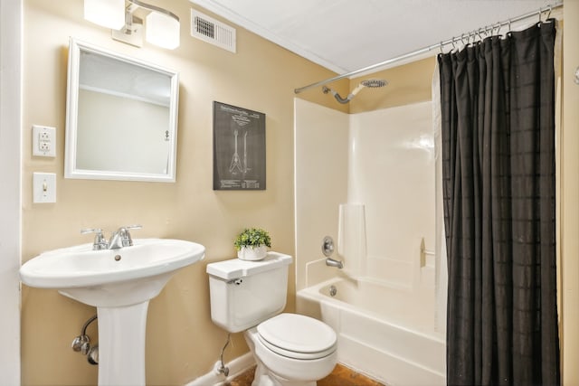 full bathroom with sink, toilet, and shower / tub combo with curtain