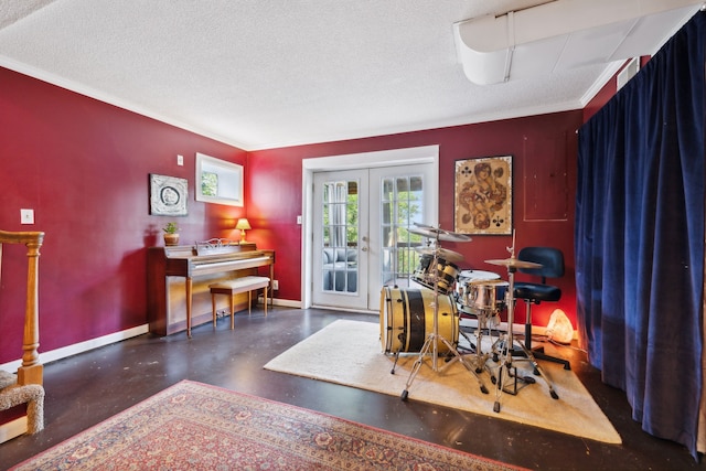 miscellaneous room with a textured ceiling, french doors, and crown molding