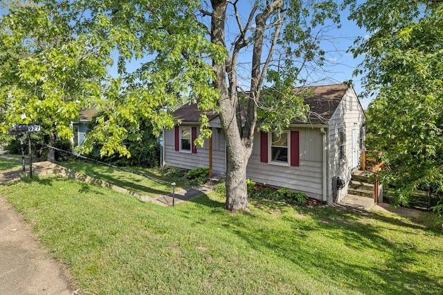 view of home's exterior with a yard